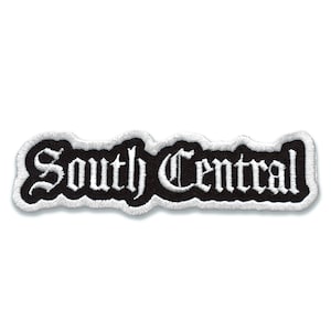 May include: Black and white embroidered patch with the text "South Central" in a white gothic font.