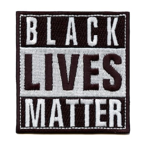 May include: Black Lives Matter embroidered patch with white lettering on a black background.