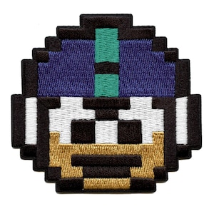 May include: A pixelated embroidered patch of a blue and green helmet with a white and black striped band and a gold and black face.