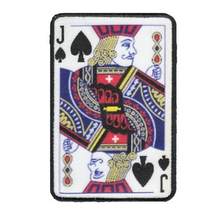 May include: A playing card patch featuring the Jack of Spades. The card is white with a black border and a colorful image of the Jack of Spades. The card has the letter "J" in the top left corner and the spade suit symbol in the bottom right corner.