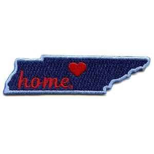 May include: A blue denim patch in the shape of the state of Tennessee with the word "home" embroidered in red and a red heart.