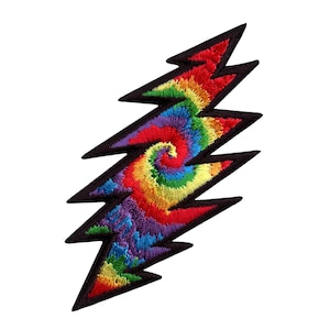 May include: A rainbow tie-dye lightning bolt patch with black stitching. The patch is a popular symbol of the Grateful Dead.