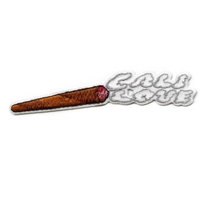 May include: An embroidered patch of a brown and red marijuana joint with white smoke that says "Cali Love" in white.