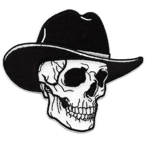 Puede incluir: Parche bordado en blanco y negro de una calavera con un sombrero de vaquero negro.