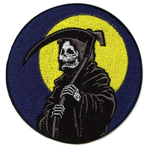 May include: Embroidered patch featuring the Grim Reaper in a black hooded cloak, holding a scythe. The design is set against a yellow moon and a dark blue circular background. The patch is likely for clothing or accessories.