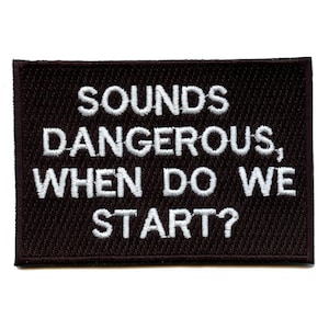Puede incluir: Parche bordado negro con texto blanco que dice "Sounds dangerous, when do we start?"