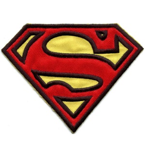 May include: Red and yellow Superman logo patch with a black outline. The patch is made of fabric and has a diamond shape.