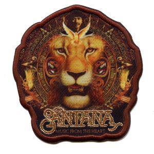 May include: A brown embroidered patch featuring a lion's face in the centre. The lion has a golden mane and is surrounded by a circular design. The text "Santana Music from the Heart" is embroidered in gold below the lion.