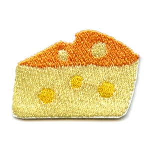May include: An embroidered patch shaped like a wedge of cheese with holes, in yellow and orange.