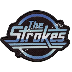May include: Embroidered patch with the band name "The Strokes" in a retro font. The design uses blue and white against a black background, with a black border. The patch has a distinctive, striking design, suitable for clothing or accessories.