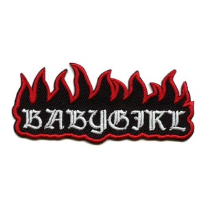 May include: White "BABY GIRL" text in a gothic font with a red flame design around the text.