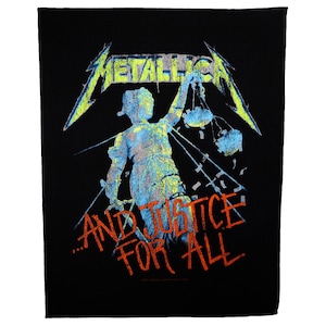 May include: Black patch with a green and blue image of a figure holding scales, with the text "...And Justice For All" in red and orange.