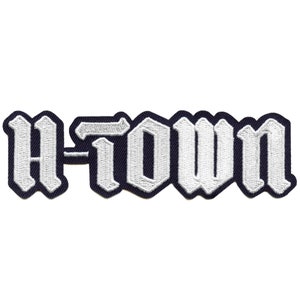 May include: White embroidered patch with the text "H-Town" in a gothic font.