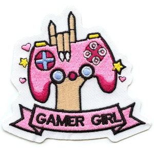 May include: Pink and black embroidered patch with a pink video game controller and a hand making the rock and roll hand gesture. A pink banner with the text "GAMER GIRL" is below the controller.