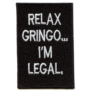 May include: Black embroidered patch with white text that reads "Relax Gringo... I'm Legal."