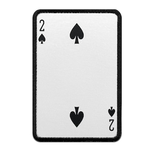 May include: A white playing card with a black border. The card shows the number 2 and the spade suit. The card is a patch.