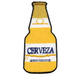 May include: Embroidered patch in the shape of a beer bottle. The patch features a yellow and white design with the word "CERVEZA" in blue. The top of the bottle is gold.