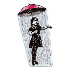 May include: Embroidered patch featuring a girl holding a red and black umbrella, standing in a rain shower. The girl is wearing a black dress and has her hair pulled back. The background is white with gray embroidered rain drops.