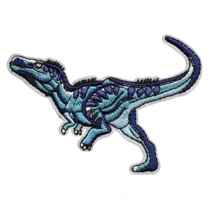 May include: Blue and purple embroidered dinosaur patch. The dinosaur is running with its mouth open and its tail curled up.