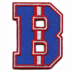 May include: Blue felt letter B with red and white stitching. The letter is outlined in white and has a red and white stripe down the center.