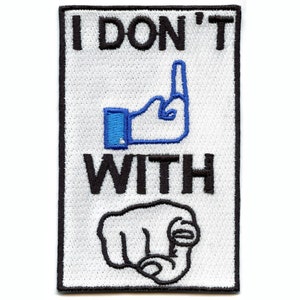 May include: White embroidered patch with black text that reads "I DON'T" with a blue thumbs down emoji and black text that reads "WITH" with a black pointing finger emoji.