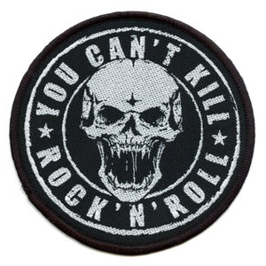 May include: Black and white embroidered patch with a skull and the text "You Can't Kill Rock 'n' Roll".