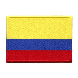 May include: A yellow, blue, and red embroidered patch depicting the flag of Colombia.
