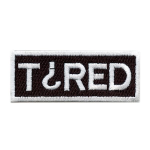 May include: White embroidered patch with black background and the text "T&RED" in white.