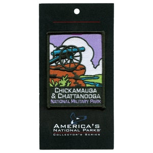 May include: A purple, green, and orange embroidered patch with a cannon on a hill. The text reads "Chickamauga & Chattanooga National Military Park" and "America's National Parks Collector's Series".