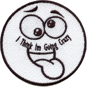 May include: White embroidered patch with a cartoon face with big eyes and a tongue sticking out. The text "I Think I'm Going Crazy" is written around the face.