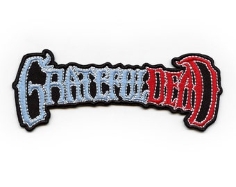 May include: Embroidered patch with the words "Grateful Dead" in a stylized font. The word "Grateful" is in light blue and the word "Dead" is in red.