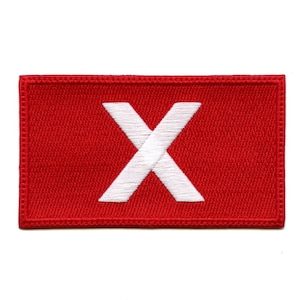 May include: Red embroidered patch with a white letter X in the centre.