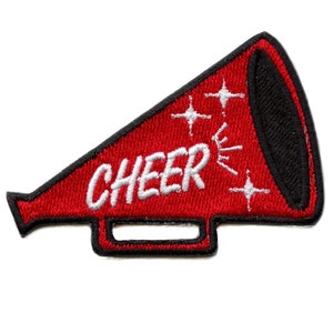 May include: Red and black embroidered iron-on patch of a megaphone with the word "CHEER" in white lettering and white stars.