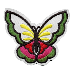 May include: Embroidered butterfly patch with green, yellow, pink, and red accents. The butterfly has a black outline and is on a white background.