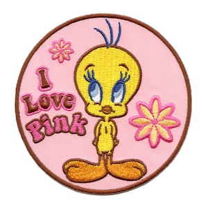 May include: A pink and brown embroidered patch featuring Tweety Bird, a yellow bird with blue eyes, standing on a pink background with the text "I Love Pink".