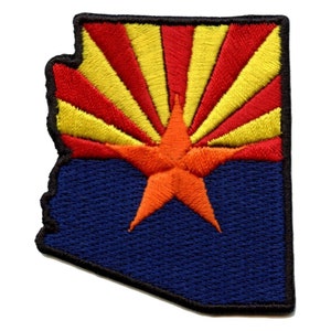 May include: An embroidered patch in the shape of the state of Arizona, featuring the state flag. The flag is red, yellow, and blue with a red star in the centre. The patch is ideal for adding a touch of Arizona pride to your belongings.