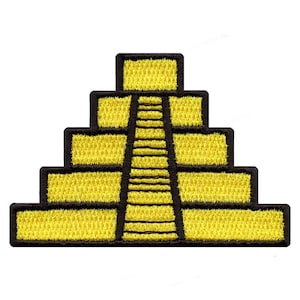 May include: Embroidered patch featuring a yellow stepped pyramid with a central staircase. The pyramid has a black border, and the steps are clearly defined. The patch is likely designed for application on clothing or accessories.