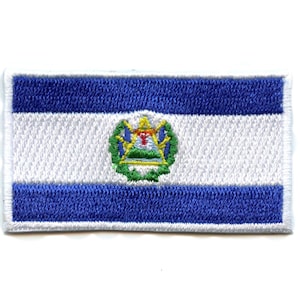 May include: An embroidered patch of the flag of El Salvador. The flag is blue, white, and blue with the national coat of arms in the center.