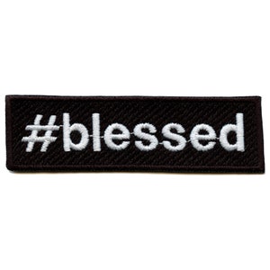 May include: Black embroidered patch with white text that reads "#blessed".