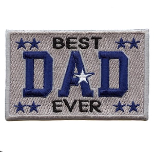 May include: A gray embroidered patch with the text "BEST DAD EVER" in black and blue lettering. The patch has four white stars around the text.
