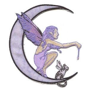 May include: An embroidered patch featuring a purple fairy sitting on a crescent moon, holding a wand. A small purple cat sits on the moon beside the fairy.