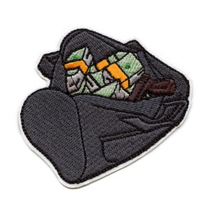 May include: A black duffel bag embroidered with green and yellow cash and a brown gun inside.