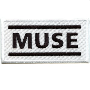 May include: White rectangular patch with black embroidered double lines and the word "MUSE" in black.