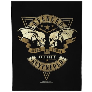 May include: A black and gold patch with the text "Avenged Sevenfold" in a stylized font. The patch features two skulls with wings, a banner that reads "Orange County California", and two stars.
