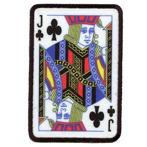 May include: A white playing card with a black border. The card shows the Jack of Clubs. The Jack is a man with a red and blue patterned suit, a yellow crown, and a long, blonde beard. The card has a white background with a black border.