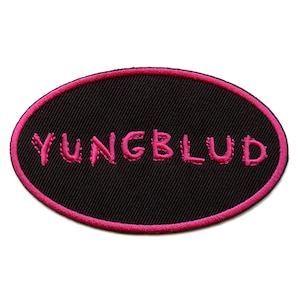 May include: A black oval patch with a pink embroidered outline and the word "YUNGBLUD" in pink.