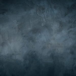May include: A dark charcoal gray surface with a mottled, textured finish. The material displays subtle variations in tone, ranging from deep black to lighter slate gray, creating a weathered, uneven appearance with visible strokes and marks.