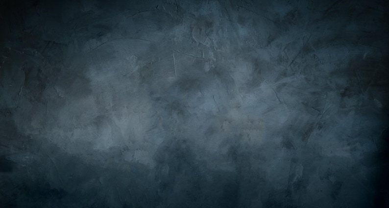 May include: A dark charcoal gray surface with a mottled, textured finish. The material displays subtle variations in tone, ranging from deep black to lighter slate gray, creating a weathered, uneven appearance with visible strokes and marks.