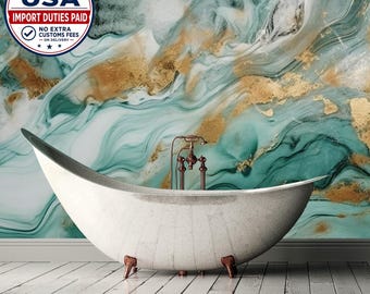 May include: A white speckled freestanding bathtub with a curved silhouette and copper-toned feet, positioned in front of a wall mural featuring swirling patterns of teal, white, and gold metallic accents.