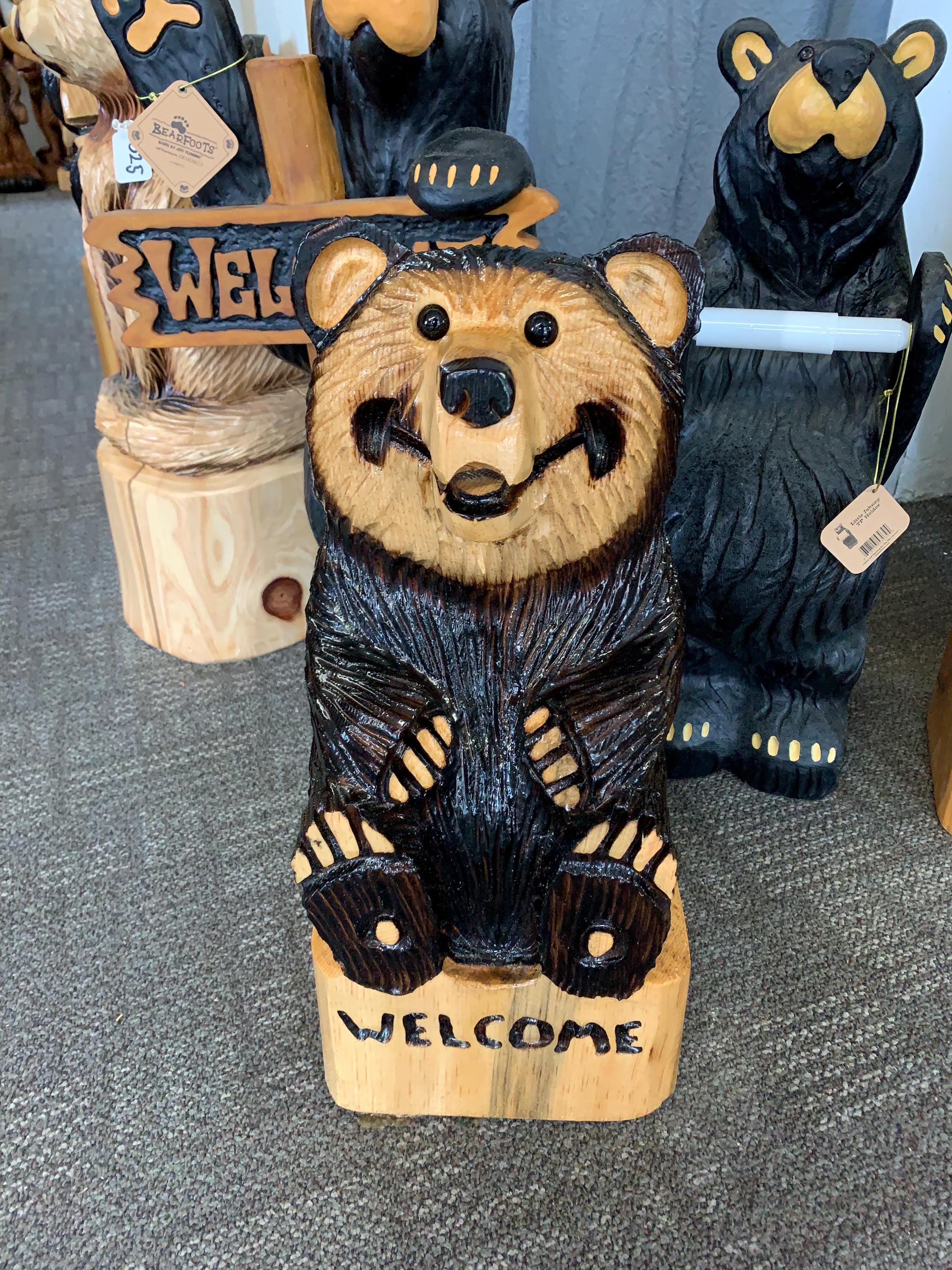 Wood carved sit down bear with welcome carved into the base